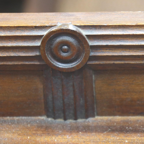 3138 - A regency period twin pedestal sideboard, having a single drawer flanked by carved and gadrooned cup... 