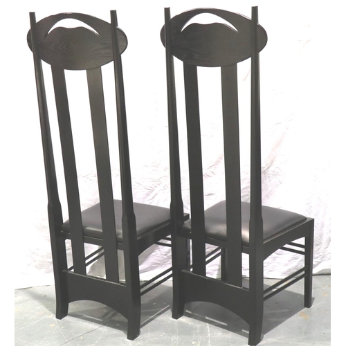 3140 - A pair of contemporary black ash high-back hall chairs, each with black leather seat pad, H: 137 cm.... 