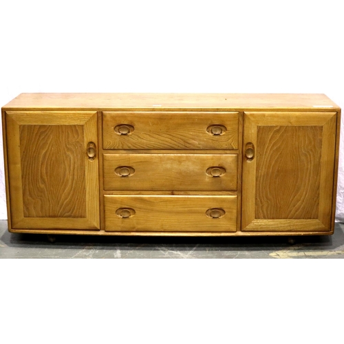 3142 - An Ercol golden dawn elm sideboard of three short drawers and two cupboard doors, H: 155 x 45 x 68 c... 