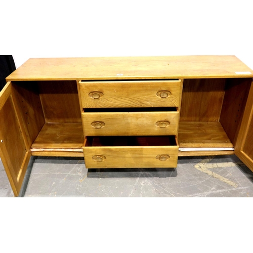 3142 - An Ercol golden dawn elm sideboard of three short drawers and two cupboard doors, H: 155 x 45 x 68 c... 