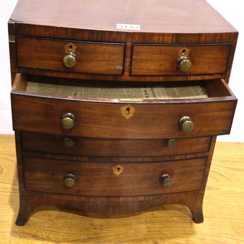 3143 - A Georgian diminutive chest of two-short above three-long drawers, possibly an apprentice piece, som... 