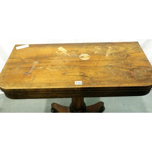 3164 - A George IV rosewood gaming table with fold-over top and columnar base, 90 x 90 x 74 cm H (open). No... 