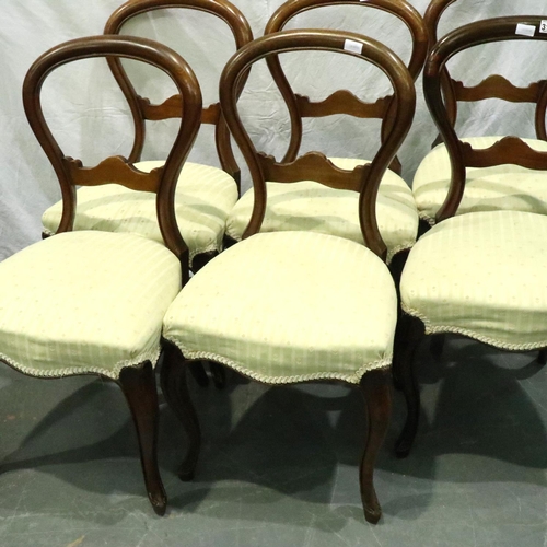 3165 - A set of six Victorian walnut balloon-back dining chairs with later upholstered seats. Not available... 