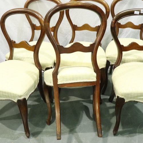 3165 - A set of six Victorian walnut balloon-back dining chairs with later upholstered seats. Not available... 