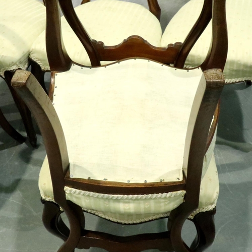 3165 - A set of six Victorian walnut balloon-back dining chairs with later upholstered seats. Not available... 