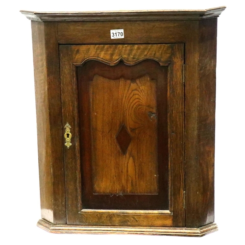 3170 - George III oak corner cupboard of small proportions with two shelves and key. Not available for in-h... 