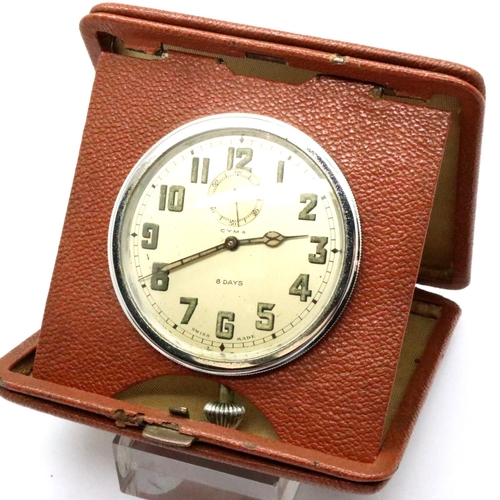 65 - Leather cased Cyma travelling clock, working at lotting. P&P Group 2 (£18+VAT for the first lot and ... 