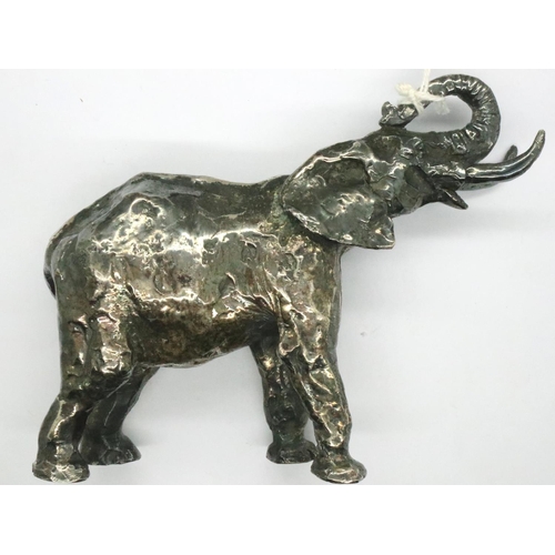 123 - White metal elephant, L: 13 cm, (tests as low grade silver). P&P Group 1 (£14+VAT for the first lot ... 