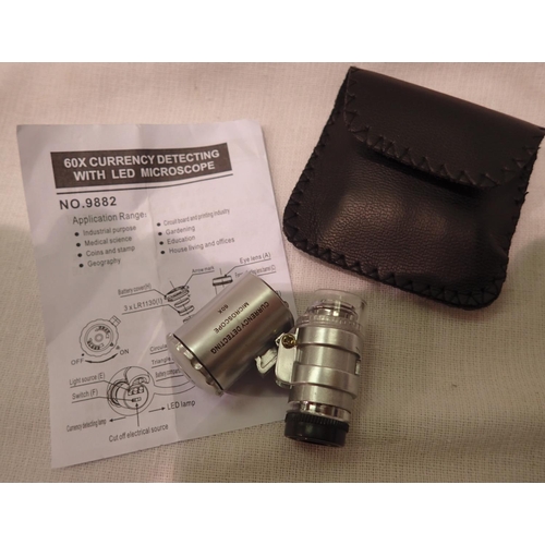 1101A - Cased 60x currency/jewellery detecting loupe with LED light batteries etc. P&P Group 1 (£14+VAT for ... 