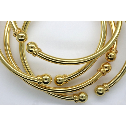 77 - Four 925 silver and gilt bangles. P&P Group 1 (£14+VAT for the first lot and £1+VAT for subsequent l... 