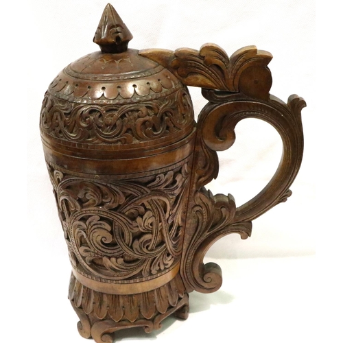 227 - 19th century large heavily carved, walnut lidded stein, H: 34 cm. Crack from below handle to the cen... 