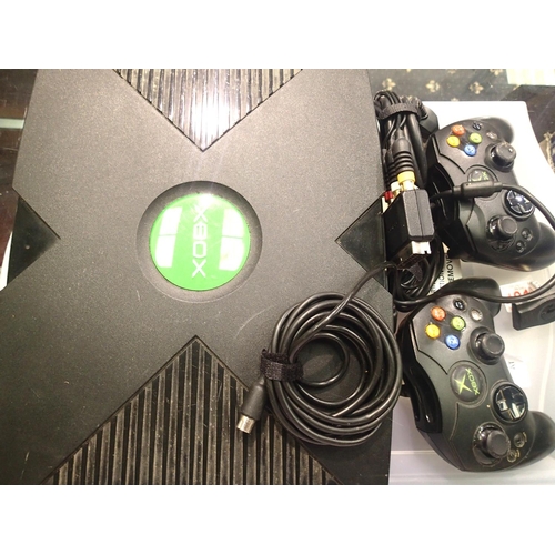 2144 - Microsoft Xbox games console with power supply and two controllers. P&P Group 3 (£25+VAT for the fir... 