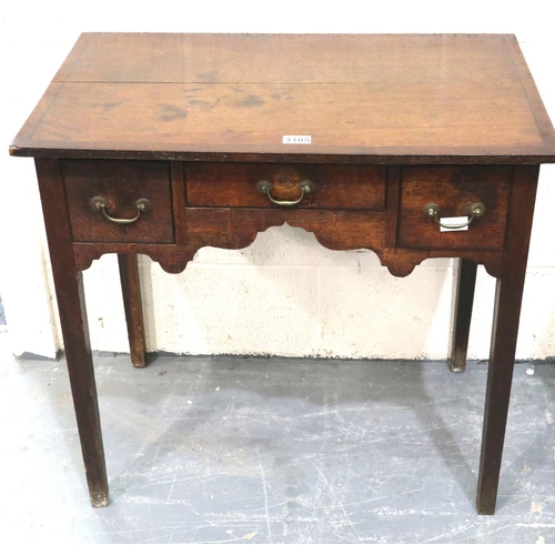 3105 - George II oak lowboy, crossbanded and inlaid with ebony, having three short drawers and shaped friez... 