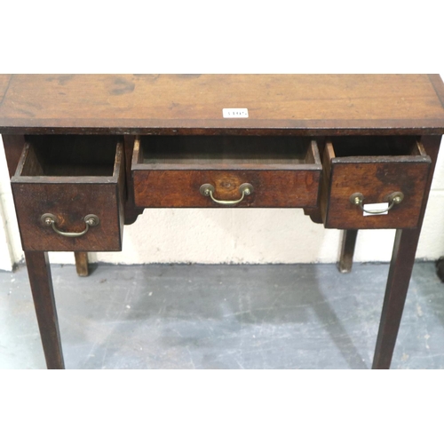 3105 - George II oak lowboy, crossbanded and inlaid with ebony, having three short drawers and shaped friez... 