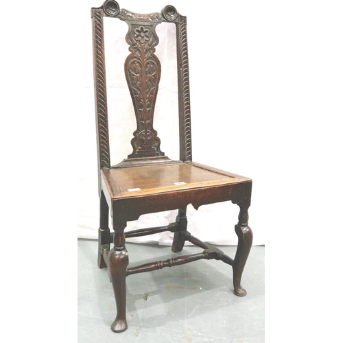 3113 - A 17th century oak hall chair, with Carolean carved back rest and panelled seat, H: 107 cm. Not avai... 