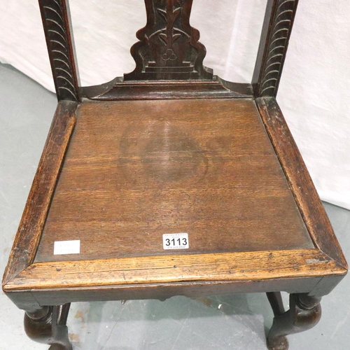 3113 - A 17th century oak hall chair, with Carolean carved back rest and panelled seat, H: 107 cm. Not avai... 