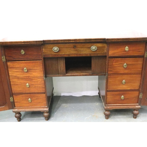 3115 - A Regency mahogany twin pedestal sideboard, each cupboard fitted with drawers and cellarette, the ce... 