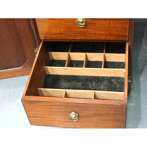 3115 - A Regency mahogany twin pedestal sideboard, each cupboard fitted with drawers and cellarette, the ce... 