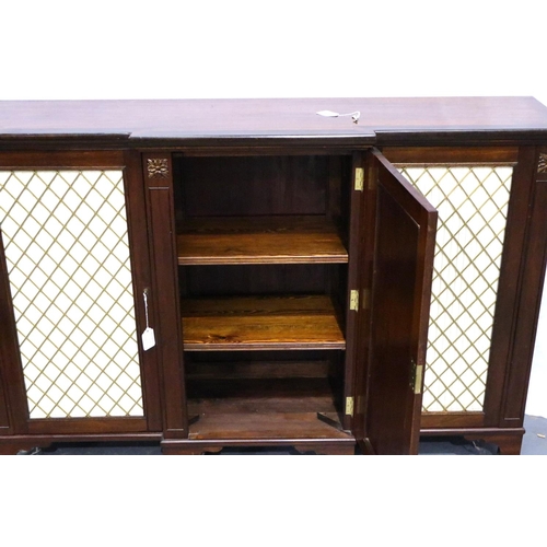 3117 - A 20th century bookcase in the regency style, three doors with adjustable shelves and break front, 1... 