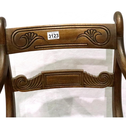 3123 - 19th century walnut elbow chair, having a carved back rail and turned supports, the seat upholstered... 