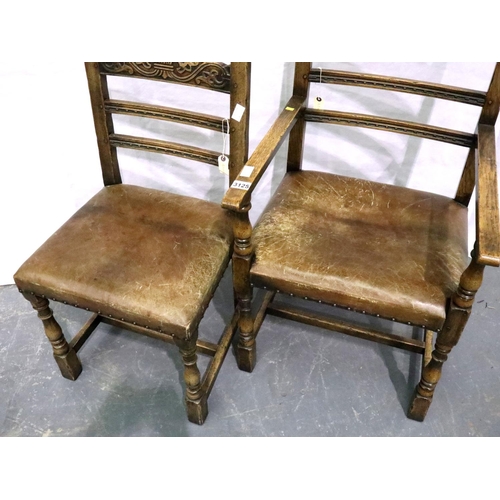 3125 - A set of six elm dining chairs, with carved laddered back rails and studded leather seats. Not avail... 