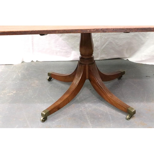 3126 - A 19th century walnut breakfast table, inlaid and raised on a quadripartite pedestal support with br... 