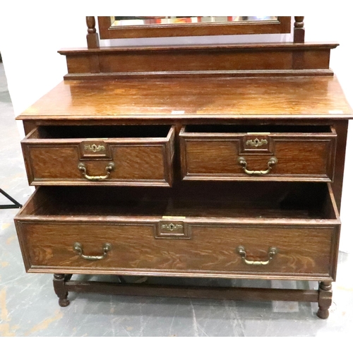 3128 - JW Hetherington of Lancaster, an oak dressing chest having two short drawers above one long drawer a... 