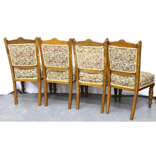 3130 - A set of four golden oak dining chairs with carved back rests and turned supports. Not available for... 