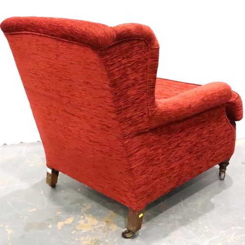 3134 - A late 19th century upholstered wing back easy chair, low seated and raised on castors, H: 86 cm. No... 