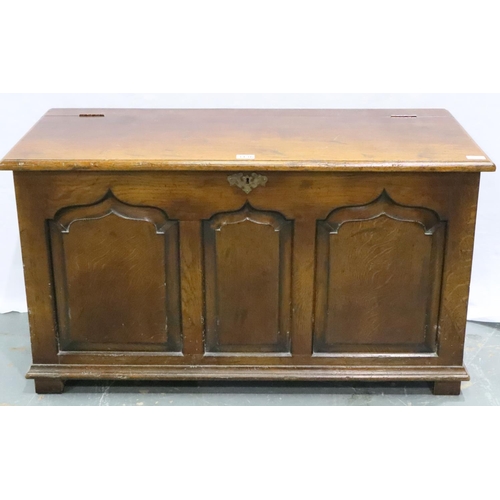 3136 - A 20th century oak blanket chest with hinged cover and panelled facia, 105 x 48 x 58 cm H. Not avail... 