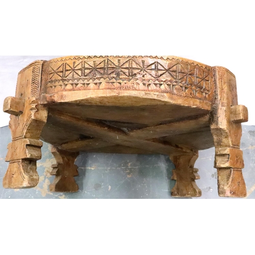 3142 - A Middle Eastern carved and footed mixing bowl with escapement, D: 72 cm, H: 30 cm. Not available fo... 