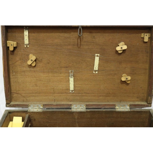 3143 - An early 19th century chest, having brass corners and hasp lock, semi fitted interior, later raised ... 