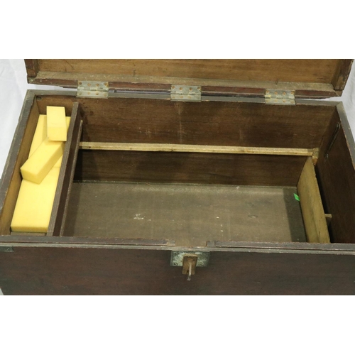 3143 - An early 19th century chest, having brass corners and hasp lock, semi fitted interior, later raised ... 