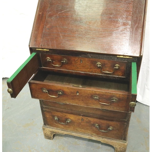 3146 - George III oak diminutive bureau, the fall front with fitted interior, faux top drawer with slide co... 