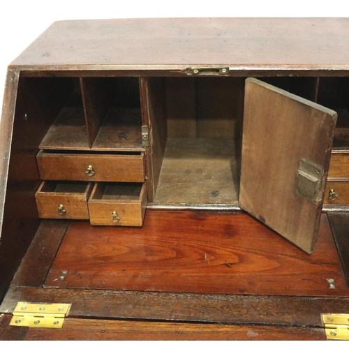 3146 - George III oak diminutive bureau, the fall front with fitted interior, faux top drawer with slide co... 