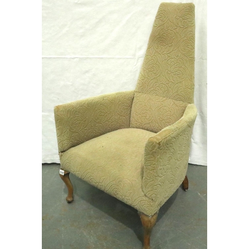 3147 - An unusual early 20th century tub chair with high back of tapering form, raised on walnut supports, ... 