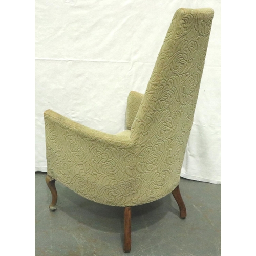 3147 - An unusual early 20th century tub chair with high back of tapering form, raised on walnut supports, ... 