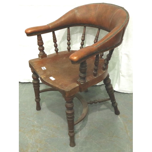 3149 - A late 19th century elm desk chair, with later studded leatherette padded arms and back rest, turned... 