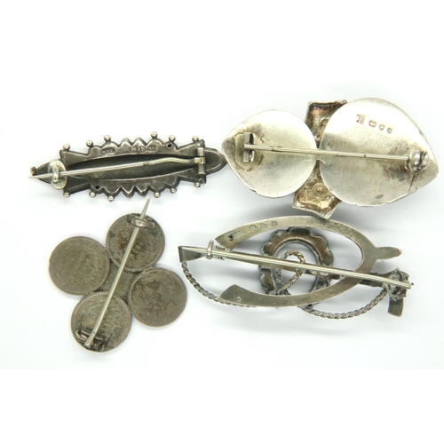 8 - Three English hallmarked silver brooches and a coin brooch, combined 25g. P&P Group 1 (£14+VAT for t... 