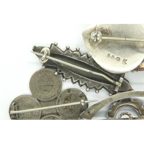 8 - Three English hallmarked silver brooches and a coin brooch, combined 25g. P&P Group 1 (£14+VAT for t... 