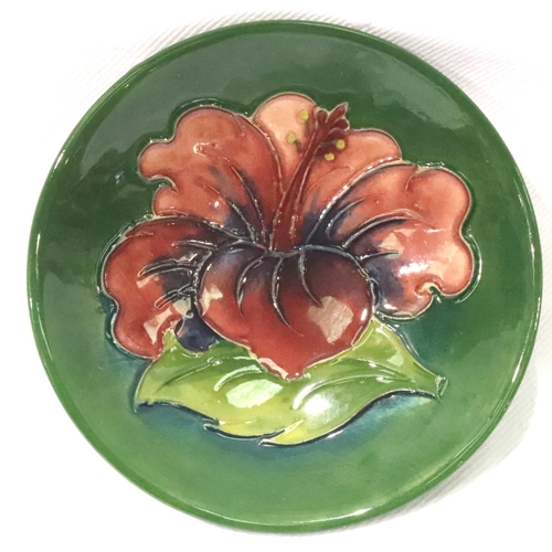 201 - Moorcroft green ground Hibiscus footed pin dish, D: 70 mm. P&P Group 1 (£14+VAT for the first lot an... 