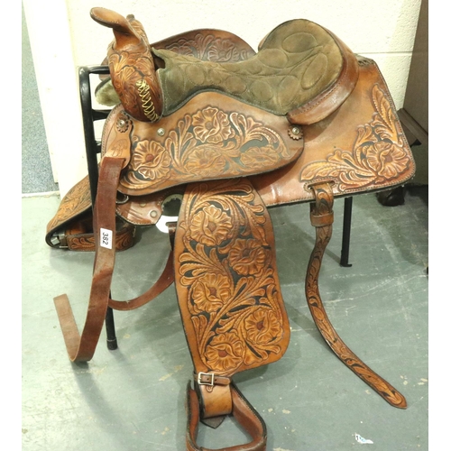 382 - Original heavily tooled American short saddle complete with fittings straps etc, never used. Not ava... 