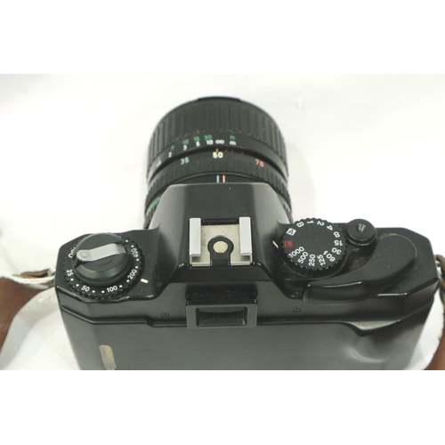 396 - Canon T60 camera with Canon Zoom lens, Tamron 80-210 lens and Mamiya flash. P&P Group 2 (£18+VAT for... 