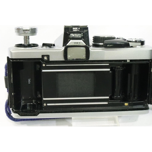 397 - Olympus OM2N with Zuiko 1:1.8 50mm lens, with case, working at lotting and an Olympus T20 dedicated ... 