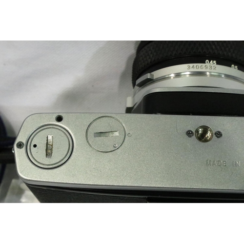 397 - Olympus OM2N with Zuiko 1:1.8 50mm lens, with case, working at lotting and an Olympus T20 dedicated ... 