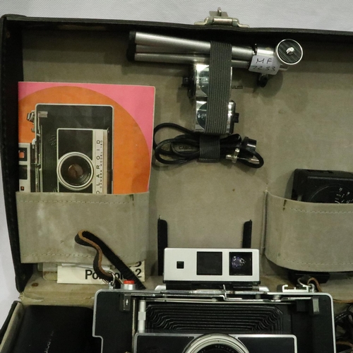 401 - Vintage Polaroid 180 land camera with extensive extras all in a hard case, camera untested. P&P Grou... 