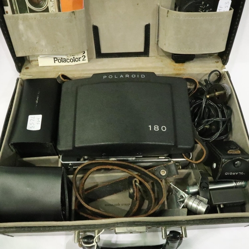 401 - Vintage Polaroid 180 land camera with extensive extras all in a hard case, camera untested. P&P Grou... 