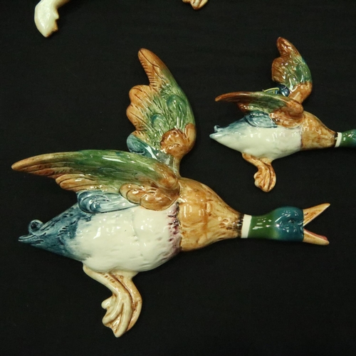 162 - Set of four Beswick flying ducks (5961, 5962, 5963, 5964), some damages. Wing re glued on number thr... 