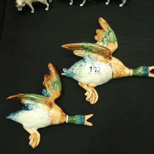 162 - Set of four Beswick flying ducks (5961, 5962, 5963, 5964), some damages. Wing re glued on number thr... 