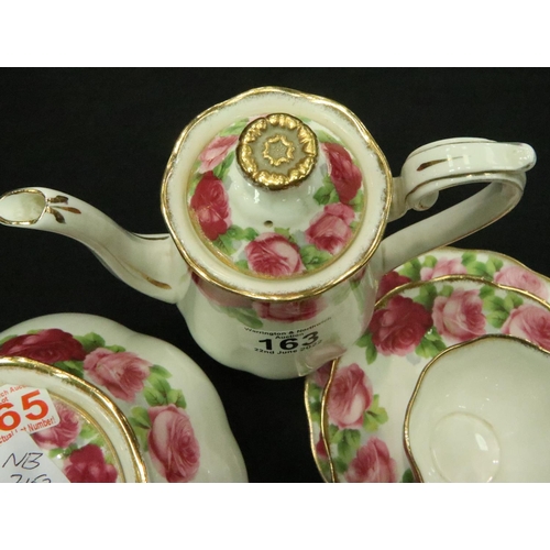 163 - Thirty five pieces of Royal Albert old English rose china including cups, plates, bowls, coffee pot,... 